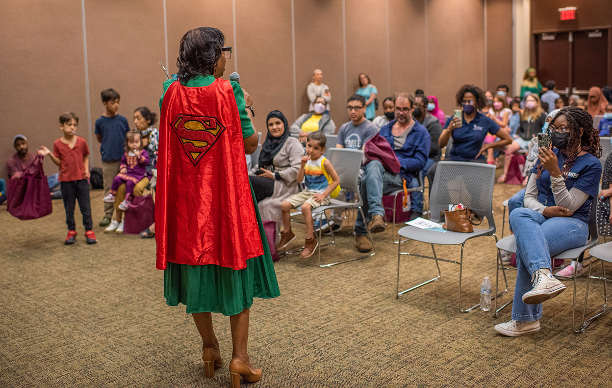 Clarkston Mayor Beverly Burks reads a story during the 2022 Clarkston Tell Me a Story Festival. Photo: Virginia Reese Photography.