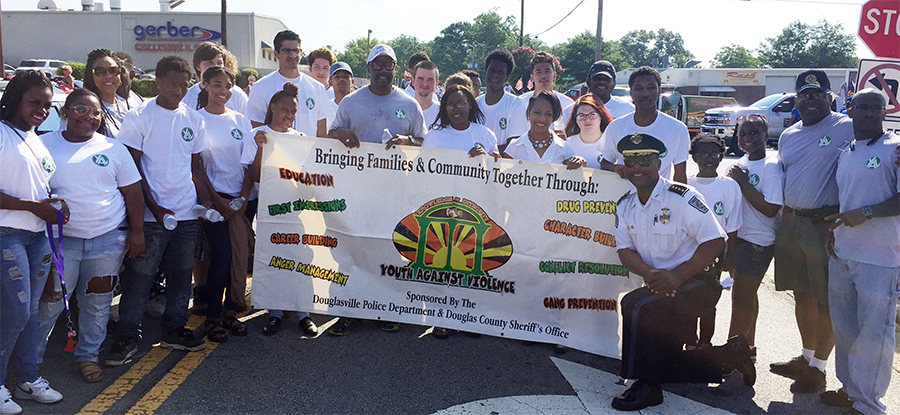 Douglasville Mayor Rochelle Robinson and Police Chief Gary Sparks with participants of the Youth Against Violence Program. Photo courtesy of the City of Douglasville.