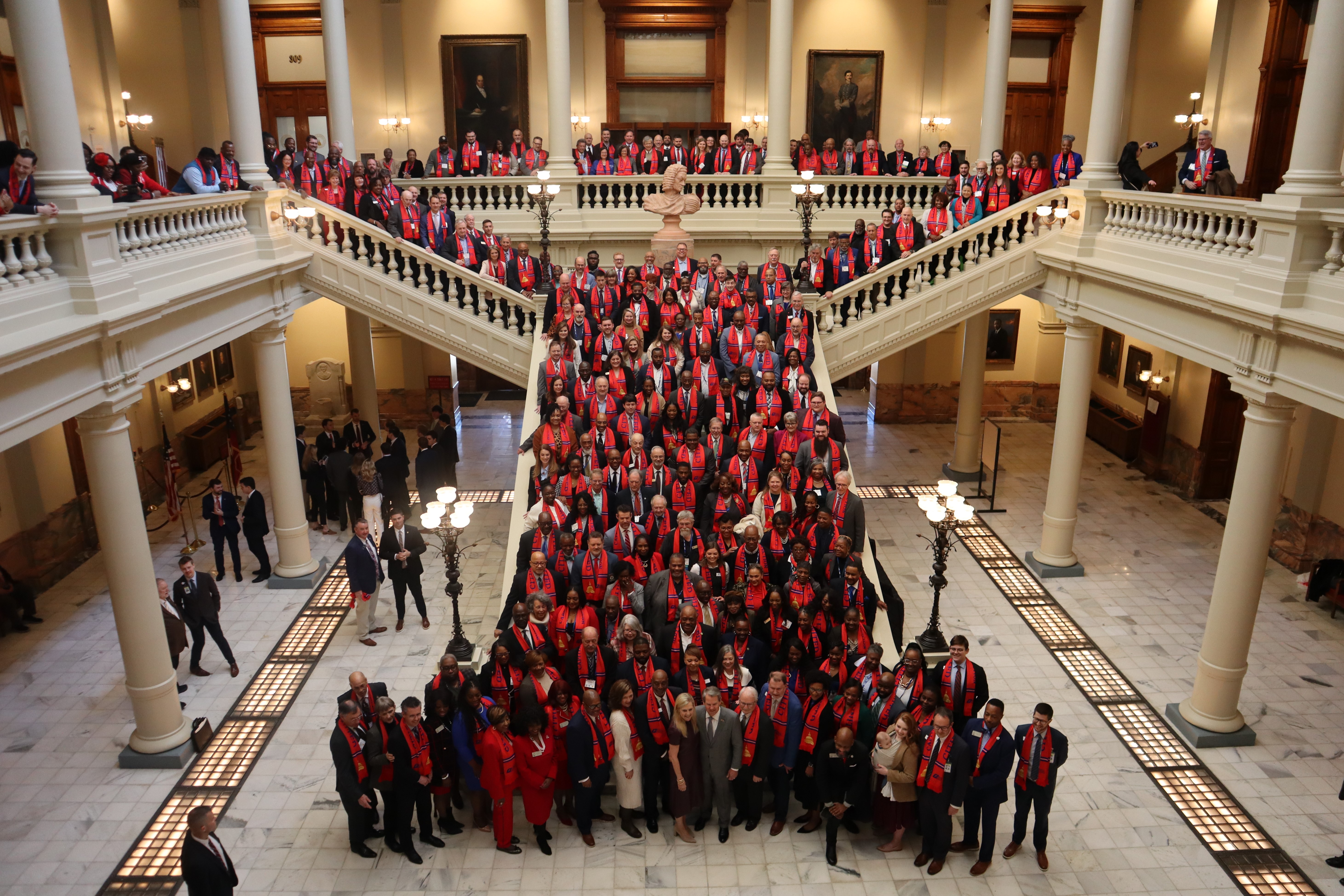 City leaders from across GA gather on the steps of the Capitol with Gov. Kemp.