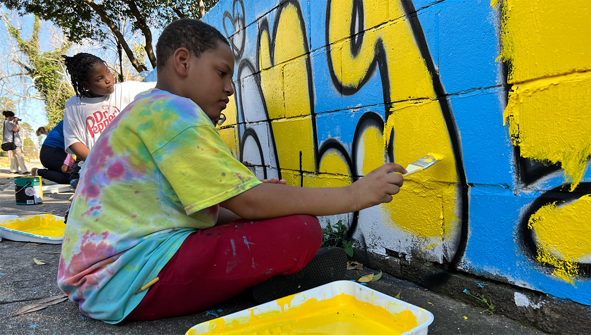 “Love is the main thing” is now painted on a retaining wall along Main Street