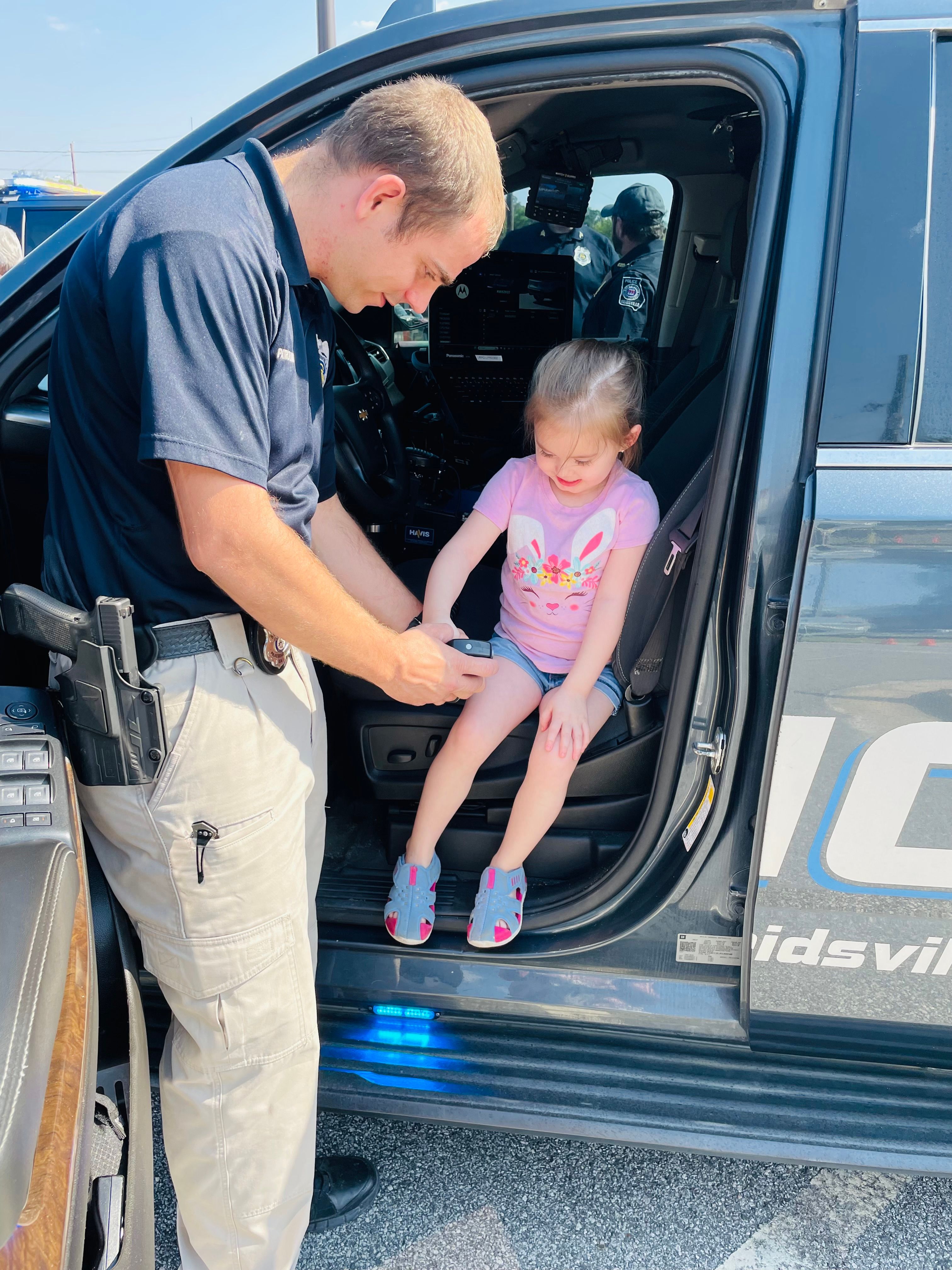 City police officer with child. 