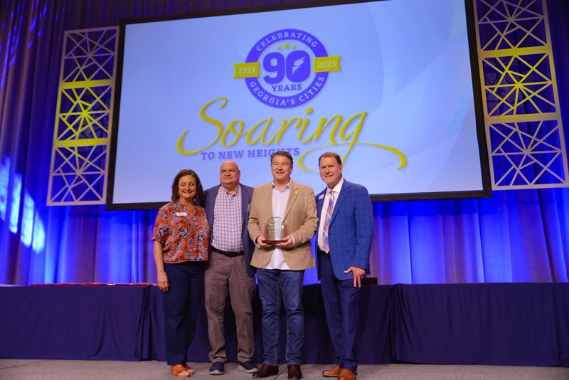 Photo of Eric Clarkson receiving his award.