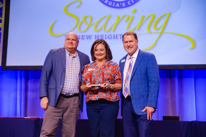 Photo of Julie Smith receiving her award.